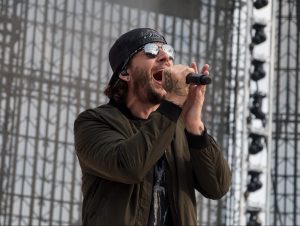M. Shadows performing on stage.