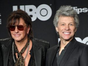 Richie Sambora and Jon Bon Jovi posing for a photo.
