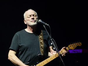 David Gilmour performing on stage.