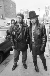 Adam Clayton and Bono of U2 pictured outside SARM Studios in Notting Hill, London, during the recording of the Band Aid single 'Do They Know It's Christmas?', part of the Feed The World campaign, raising money for famine-stricken Ethiopia, on November 25, 1984.