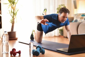 middle-aged man virtually working out at home