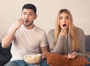 Couple watching TV shocked