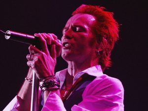 Scott Weiland performing on stage.