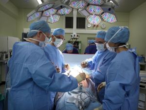 A surgeon and his theatre team perform key hole surgery to remove a gallbladder