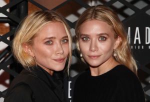 Mary-Kate Olsen and Ashley Olsen attend the Lexus Design Disrupted Fashion Event wearing black.
