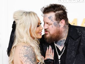 jelly Roll and his wife Bunnie dressed in black on the CMA Red Carpet