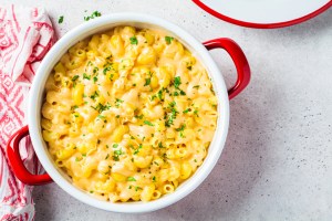 Baked Mac and cheese in red pot, top view.