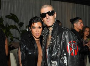 Kourtney Kardashian Barker and Travis Barker attend the GQ Men of the Year Party 2022 wearing leather jackets.