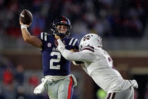 Jaxson Dart #2 of the Mississippi Rebels attempts a pass against Tyrus Wheat #2 of the Mississippi State Bulldogs during the second half at Vaught-Hemingway Stadium