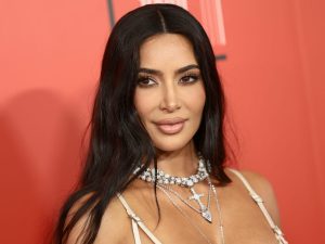 Kim Kardashian attends the 2023 TIME100 Gala wearing a strappy white dress and diamond necklace.