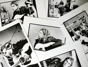 A selection of prints by Michel Linssen from the Redferns collection, depicting Kurt Cobain playing the guitar in a recording studio, pictured at the Getty Images Hulton Archive, London E16, 12th September 2023.