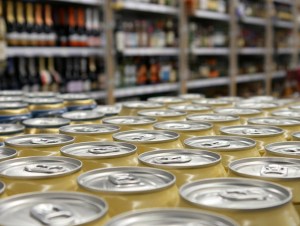 Close-up of many cans with alcohol beverage in alcohol department, canned hard cider concept.