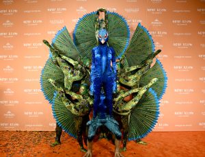 Heidi Klum attends Heidi Klum's 22nd Annual Halloween Party dressed up as a peacock with backup dancers.