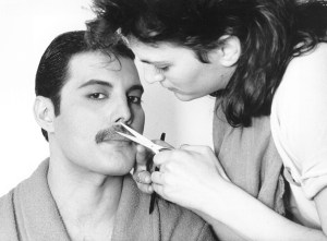 Freddie Mercury (Frederick Bulsara, 1946 - 1991), of the popular British group Queen, has his moustache groomed.