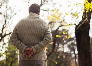 Senior man walking and relaxing in park