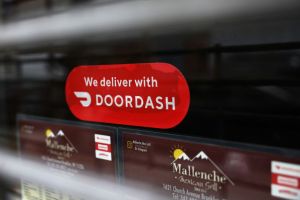 DoorDash sign. A DoorDash driver left an angry note for a customer they thought didn't leave a tip