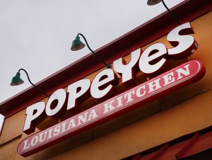 sign hangs outside of a Popeyes Louisiana Kitchen restaurant on May 06, 2021 in Chicago, Illinois