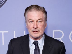 Alec Baldwin attends The Roundabout Gala 2023 wearing a suit and tie.