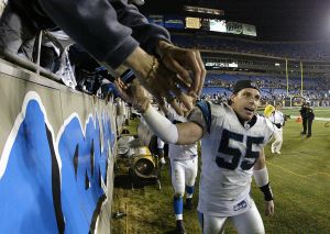 Linebacker Dan Morgan #55 of the Carolina Panthers celebrates with fans after a game.