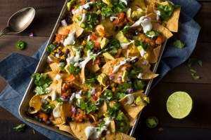 Homemade Loaded Sheet Pan Nachos with Cilantro Lime Tomato and Onion