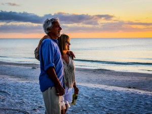 Active retirees enjoy the sunset on Siesta Key beach FL