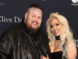 Jelly Roll and his wife Bunnie wearing black on a GRAMMY week red carpet.