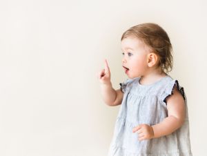 Image of a baby girl pointing.