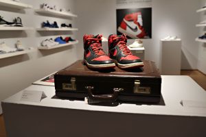 Air Jordan 1 High “Black/Red,” salesman sample sneakers and briefcase are on display during a press preview.