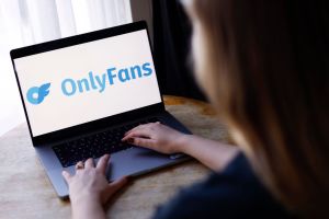 Person looking at the OnlyFans logo on a computer