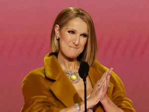 Celine Dion speaks onstage during the 66th GRAMMY Awards