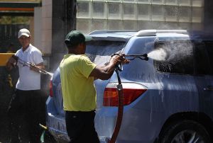 People washing a car at a car wash