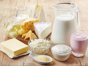 Various fresh dairy products on wooden background