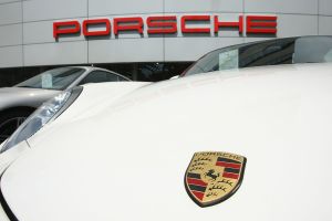 Porsche car outside of a Porsche dealership