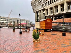 A free sauna set up in Boston's City Hall on a cloudy day.