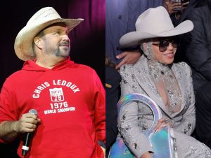 Garth Brooks is on stage in a red hoodie and cowboy hat, and Beyoce in a silver outfit, cowboy hat, and sunglasses.