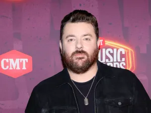 Chris Young's Orange T-shirt - Chris is on a CMT red carpet wearing a black shirt and jacket.