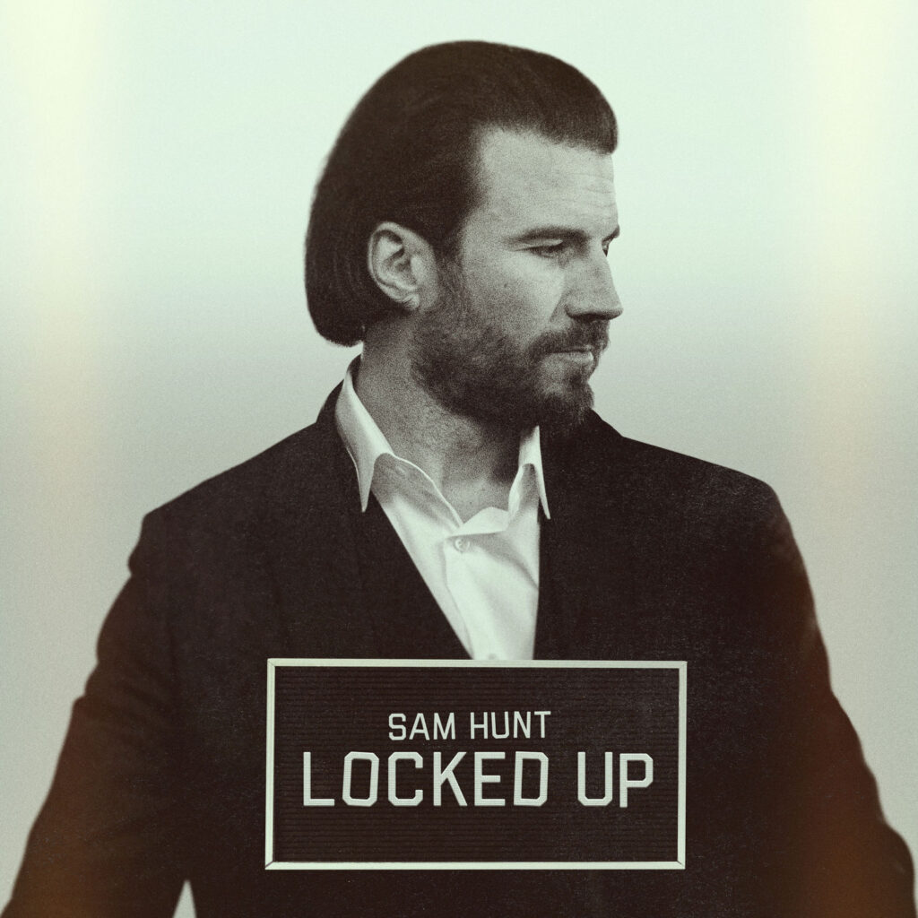The cover of Sam Hunt's"Locked Up" and he's wearing a white shirt and back blazer. 
