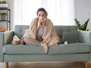 A sick woman on the couch.