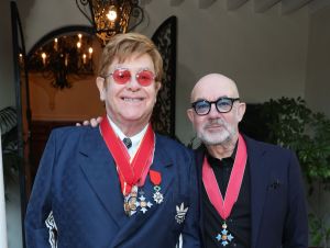 Sir Elton John and Bernie Taupin CBE attend His Majesty's Consul General CBE Medal presentation for Bernie Taupin on November 18, 2022 in Los Angeles, California.