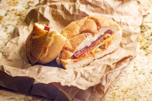 Best breakfast sandwich in New Jersey - Taylor ham, pork roll, egg and cheese breakfast sandwich on a kaiser roll with salt pepper and ketchup.