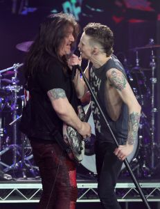 Guitarist Snake Sabo (L) and singer Erik Grönwall of Skid Row perform as the band opens for the Scorpions' nine-date residency, "Sin City Nights" at Zappos Theater at Planet Hollywood Resort & Casino on March 26, 2022 in Las Vegas, Nevada.