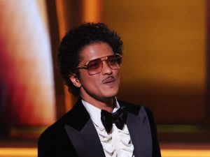 Bruno Mars accepts the Song Of The Year award for ‘Leave The Door Open’ onstage during the 64th Annual GRAMMY Awards, Bruno Mars Allegedly Owes $50 Million In Gambling Debt.