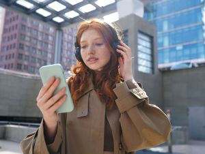A woman with red hair listening to music. This story is on the relationship between music and borderline personality distorder.