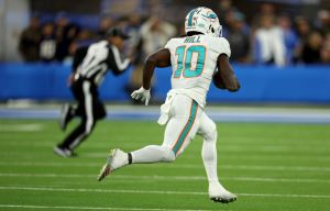 Tyreek Hill #10 of the Miami Dolphins runs in the second quarter during a game against the Los Angeles Chargers. Hill will have speed academy camps this spring.