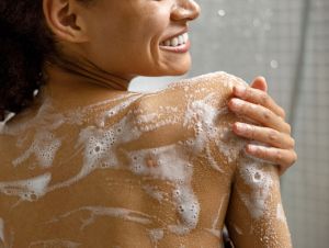 A woman showering.