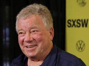 William Shatner attends the "You Can Call Me Bill" world premiere smiling looking left wearing a blue shirt, William Shatner's Secret To Remaining 'Energetic' At 93.