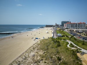 A drones view looking south at Asbury parks beach, hotels and boardwalk.