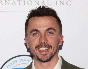 Frankie Muniz attends the Mark Wahlberg Youth Foundation Celebrity Invitational Gala smikling wearing a blazer and white collared undershirt, Why Frankie Muniz Won't Let His Son Be A Child Actor.