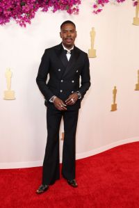 Colman Domingo attends the 96th Annual Academy Awards wearing a black double-breasted suit.