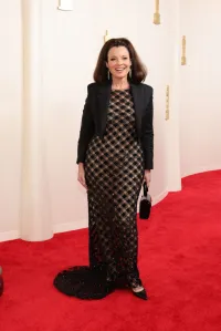 Fran Drescher attends the 96th Annual Academy Awards wearing a black mesh dress.